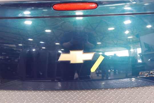 03-06 Chevy SSR Rear Tail Gate (Aqua Blur Metallic 26U)Paint Damage Below Emblem