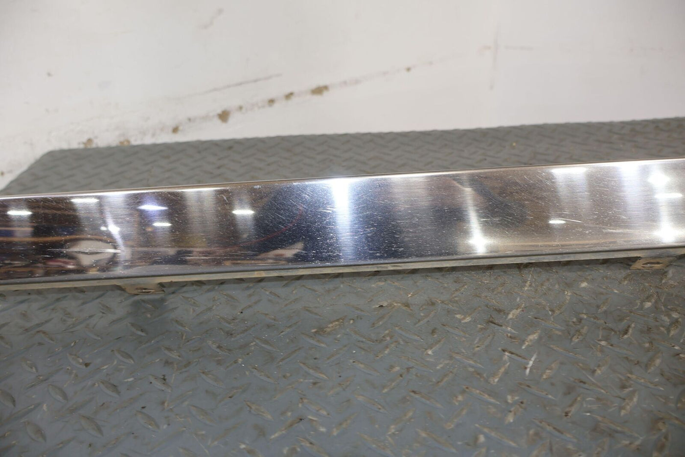 87-89 Cadillac Brougham Right Chrome OEM Rocker Moulding (Lt. Weathered) Dented