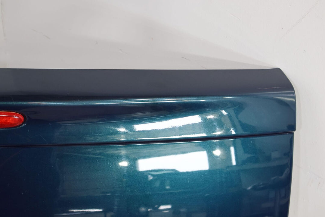 03-06 Chevy SSR Rear Tail Gate (Aqua Blur Metallic 26U)Paint Damage Below Emblem