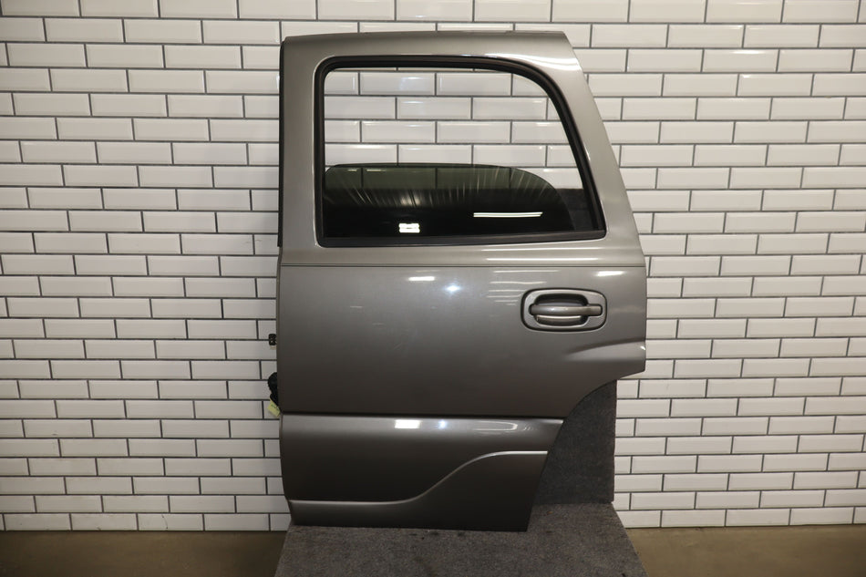 2001-2006 GMC Yukon Left Rear Door Steel Grey ( 16U ) 89023021