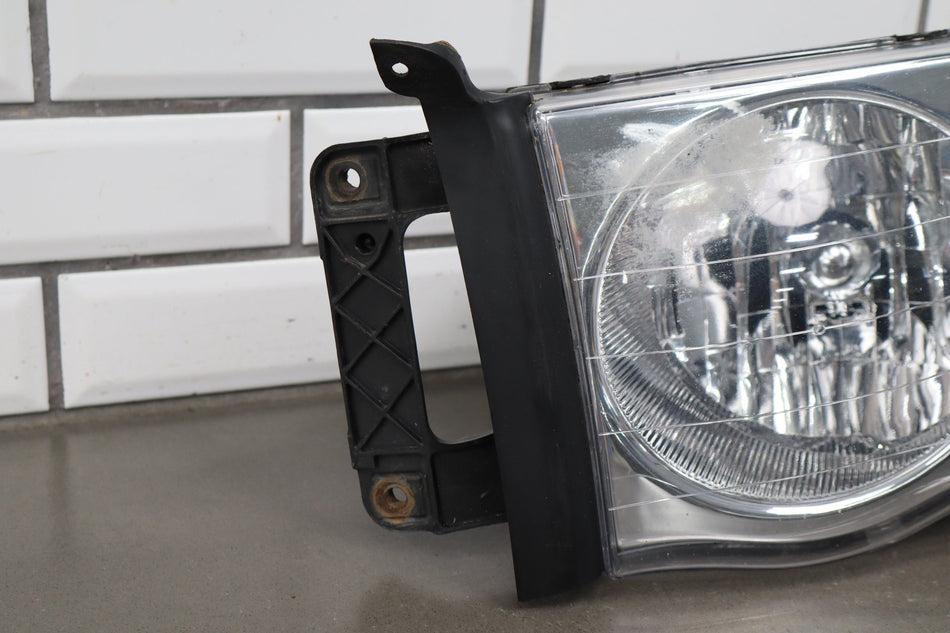 02-05 Dodge Ram LH Headlight OEM 55077121AG