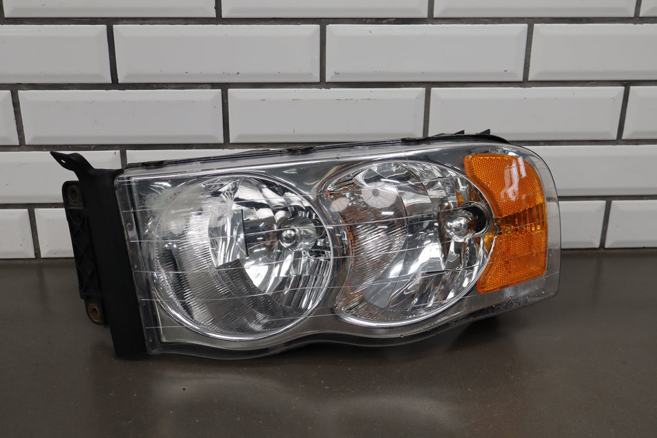 02-05 Dodge Ram LH Headlight OEM 55077121AG