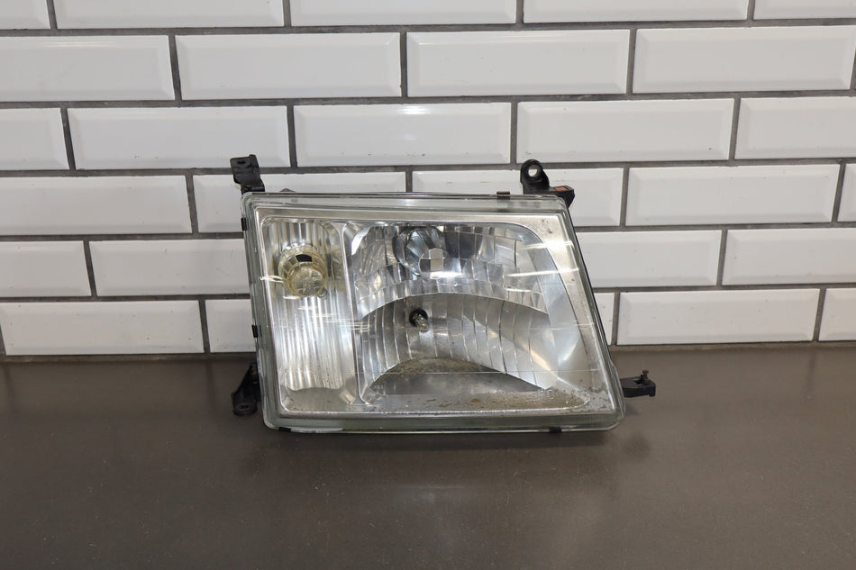 1998-04/2005 Toyota Land Cruiser Glass Lens Right Headlamp 8101060072