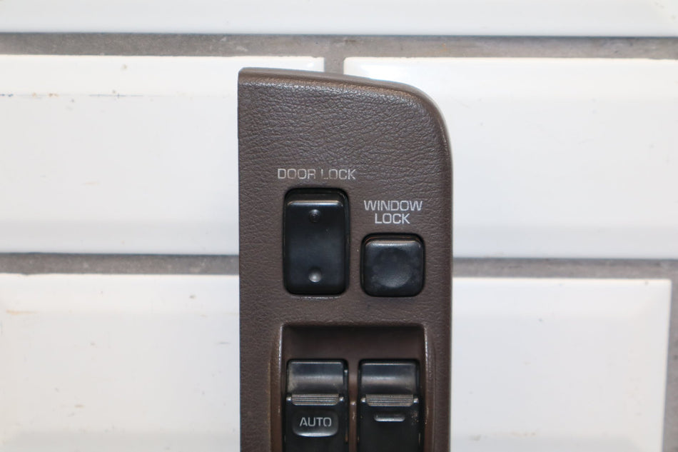 1991-1994 Toyota Land Cruiser FJ80 LH Master Window Switch W/ Bezel