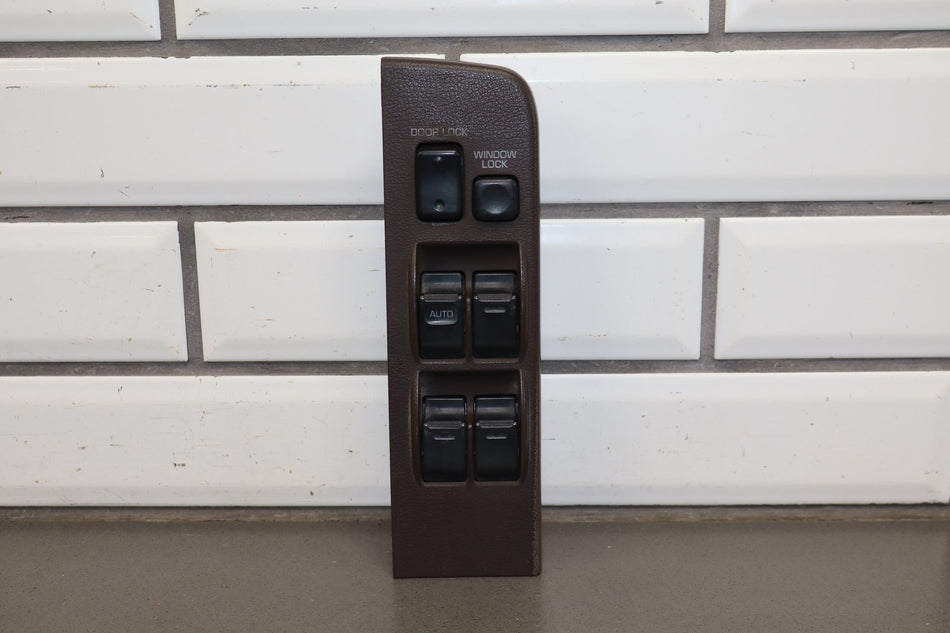 1991-1994 Toyota Land Cruiser FJ80 LH Master Window Switch W/ Bezel
