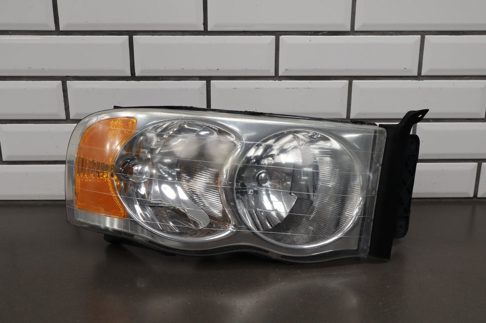02-05 Dodge Ram RH Headlight OEM 55077120AG